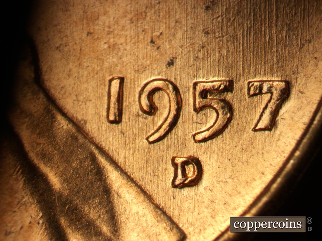 Die-stage A marker on 1957D•1MM•093 showing N/S die scratches through date and mint mark.