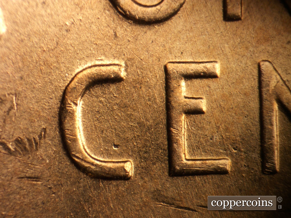 Die-stage A marker on 1957D•1MM•093 showing NNW die scratches through C in CENT.