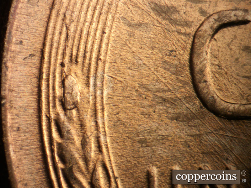 Die-stage B marker on 1957D•1MM•097 (1957 Repunched Mint Mark).