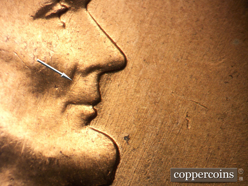 Die-stage B marker on 1957D•1MM•098 (1957 Repunched Mint Mark).