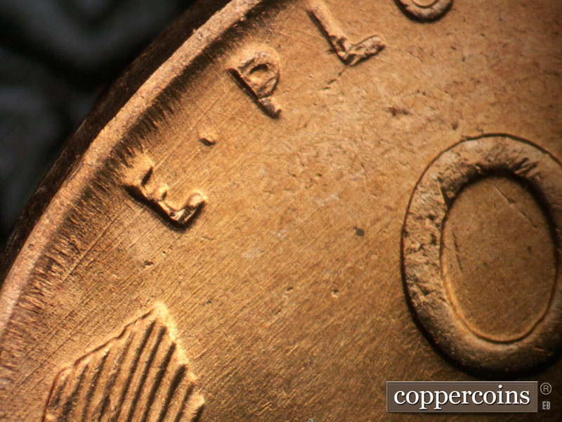 Die-stage B marker on 1957D•1MM•098 (1957 Repunched Mint Mark).