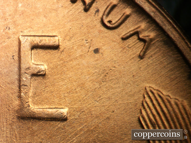 Die-stage B marker on 1957D•1MM•098 (1957 Repunched Mint Mark).