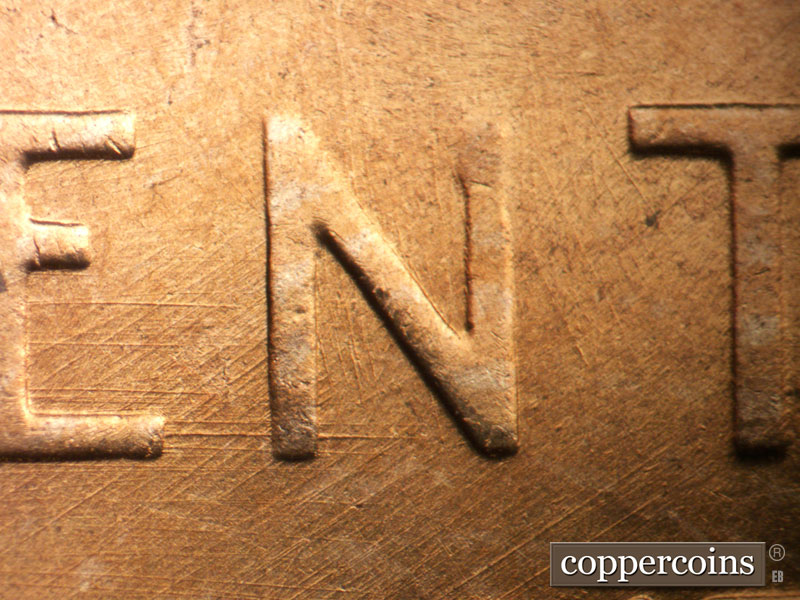 Die-stage B marker on 1957D•1MM•098 (1957 Repunched Mint Mark).
