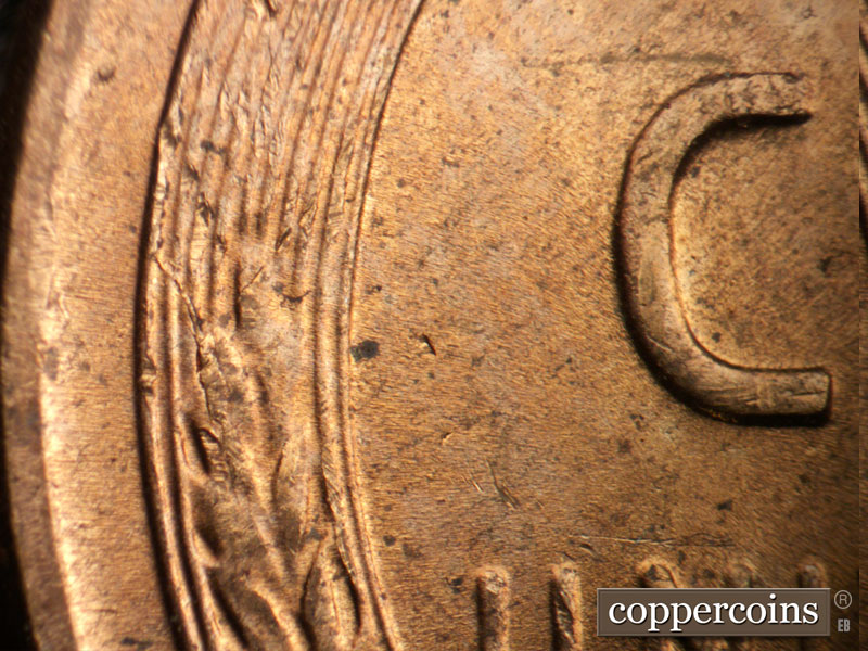 Die-stage B marker on 1957D•1MM•099 (1957 Repunched Mint Mark).