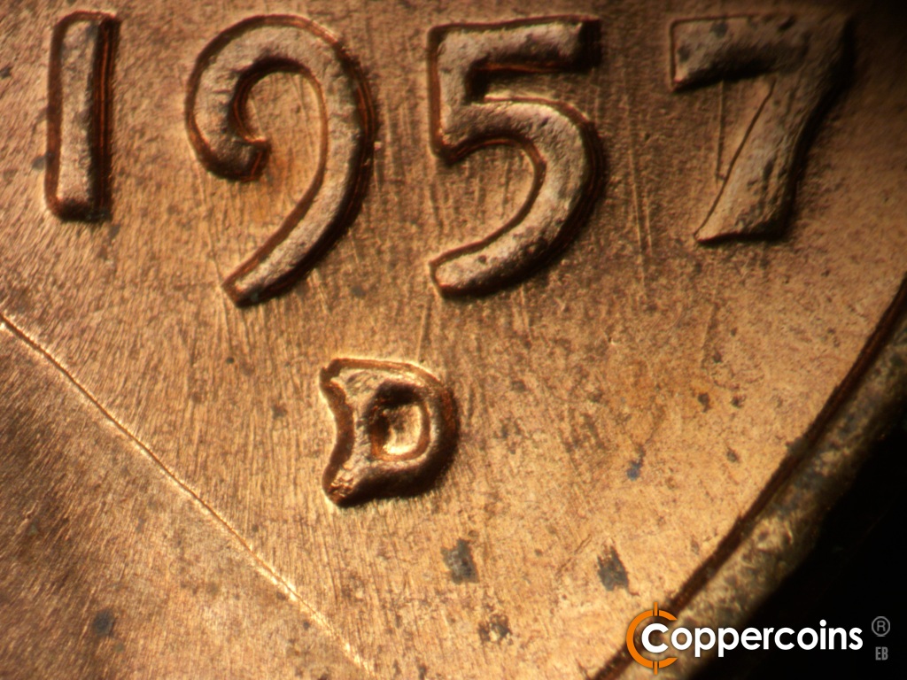 Die-stage B marker on 1957D•1MM•104 showing epunched mint mark.