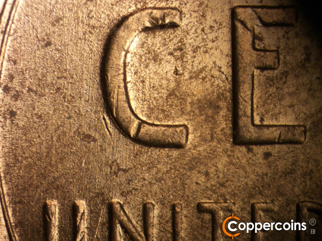 Die-stage B marker on 1957D•1MM•105 showing Light N/S die scratches through C in CENT.