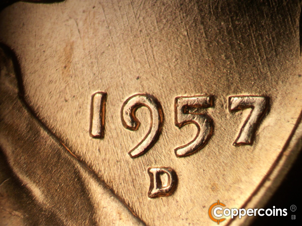 Die-stage B marker on 1957D•1MM•107 showing SSE die scratches through date.
