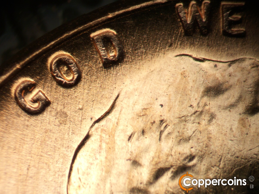 Die-stage B marker on 1957D•1MM•107 showing Die dot under O in GOD.