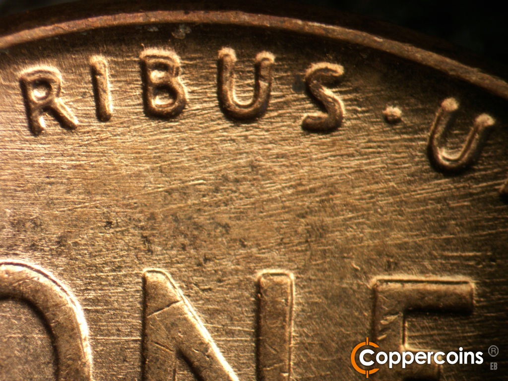 Die-stage B marker on 1957D•1MM•109 showing Die scratches cover upper center of reverse.
