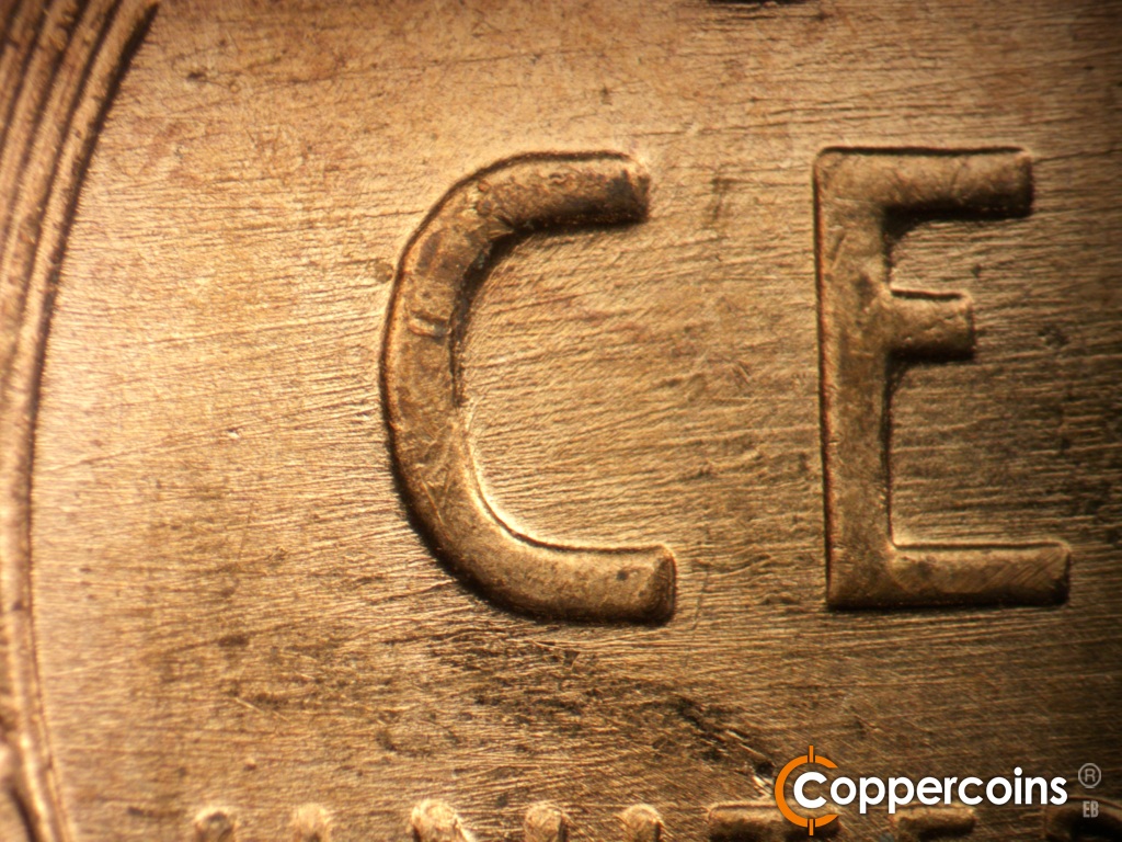 Die-stage B marker on 1957D•1MM•109 showing Die scratches through CE in CENT.