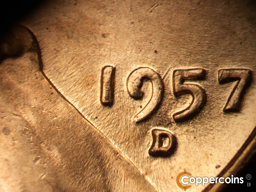 Die-stage C marker on 1957D•1MM•110 showing Neavy NE die gouge from upper 9 in date. die chip in 9 of date.