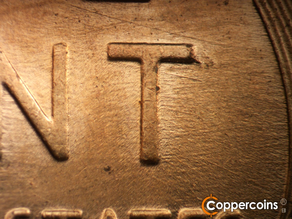 Die-stage C marker on 1957D•1MM•110 showing Die chip on upper T in CENT. Die scratches through T in CENT.