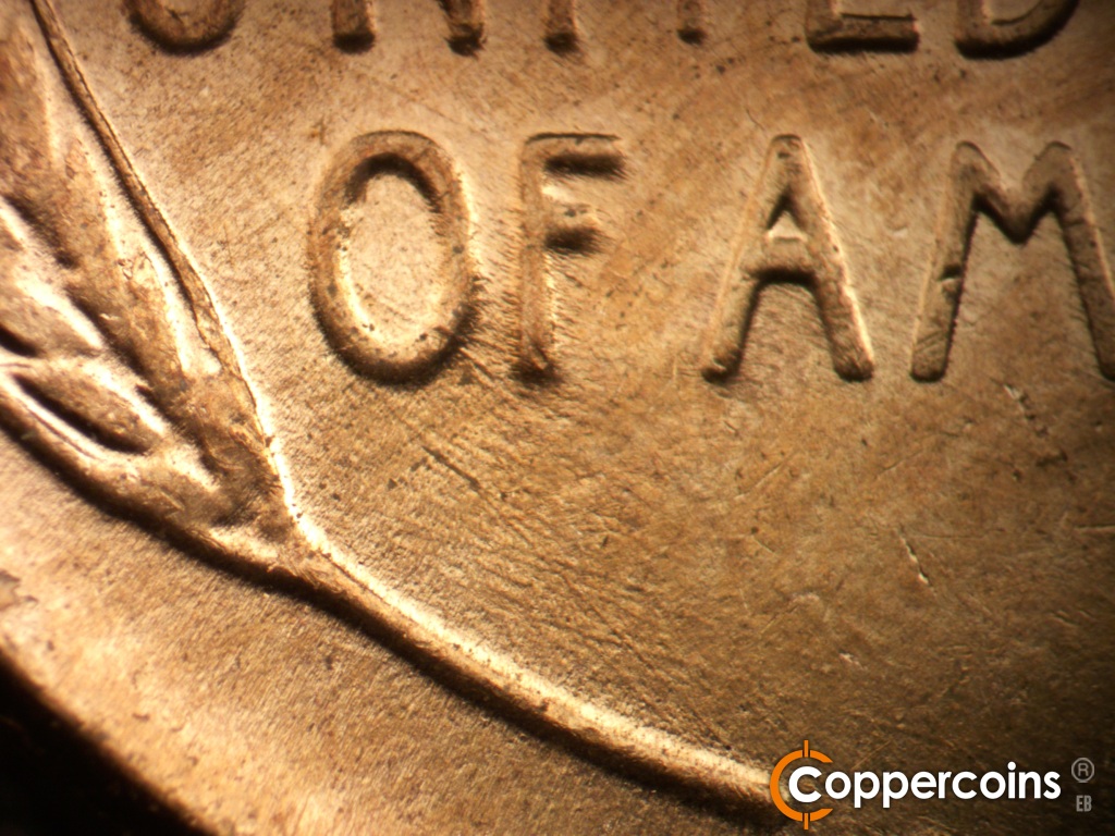 Die-stage C marker on 1957D•1MM•110 showing Die scratches through OF.