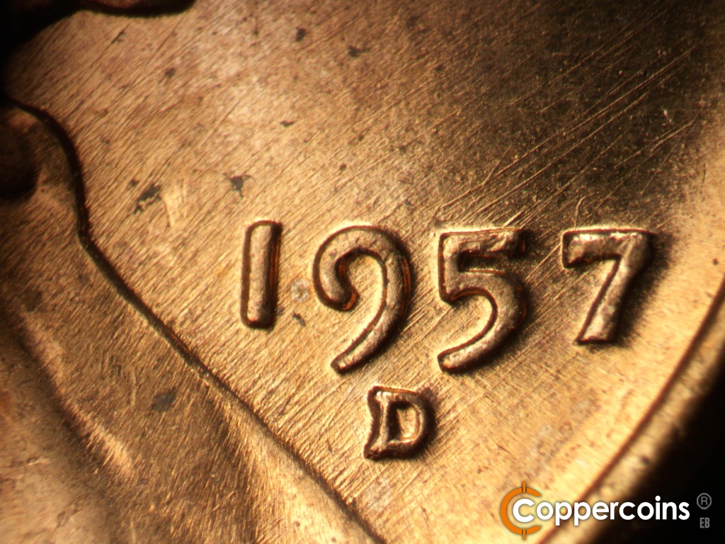 Die-stage B marker on 1957D•1MM•111 showing NE die scratches thorugh date.