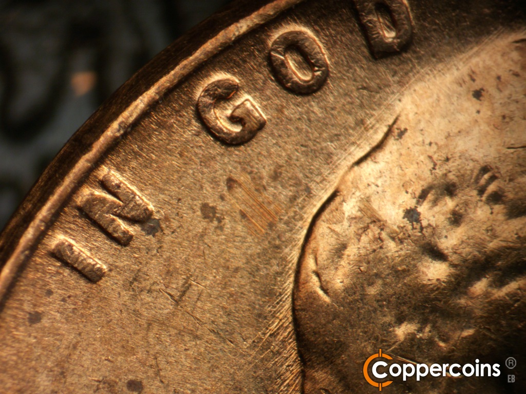 Die-stage B marker on 1957D•1MM•111 showing NE die scratches above hair hair under GOD.