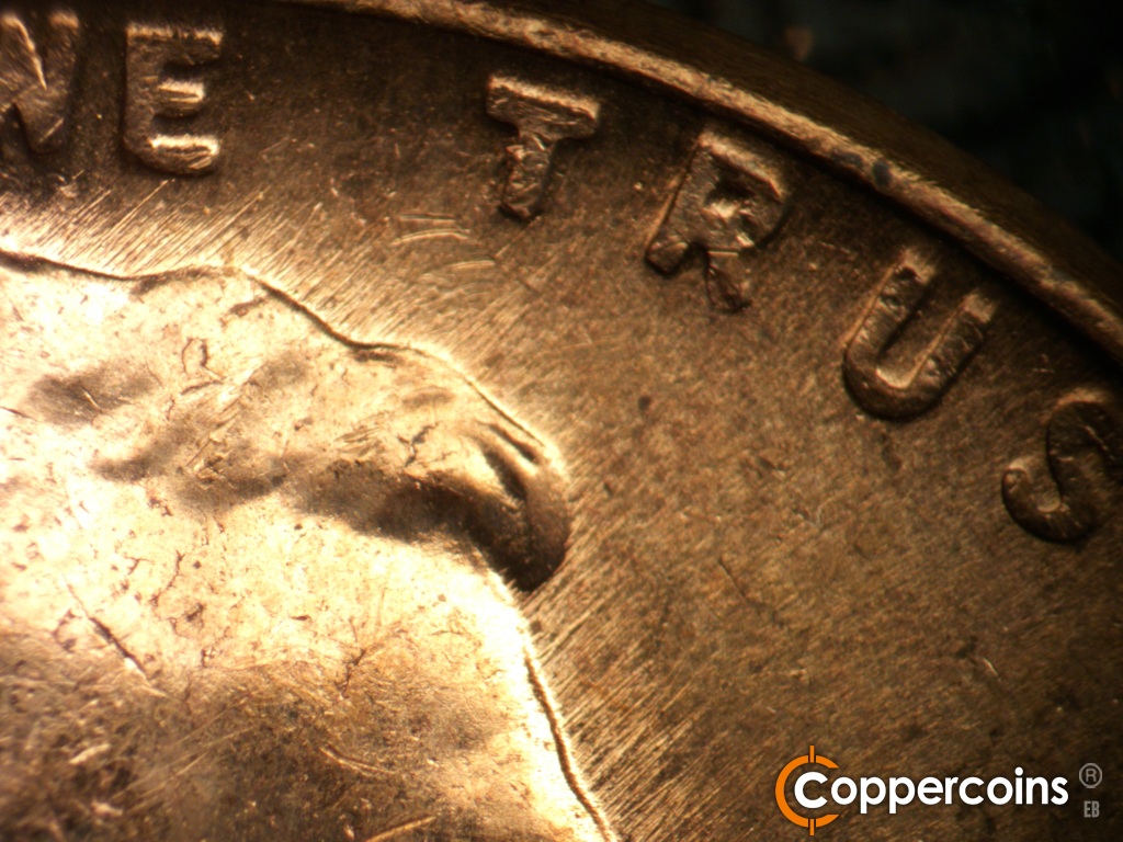 Die-stage B marker on 1957D•1MM•111 showing NE from forehead.