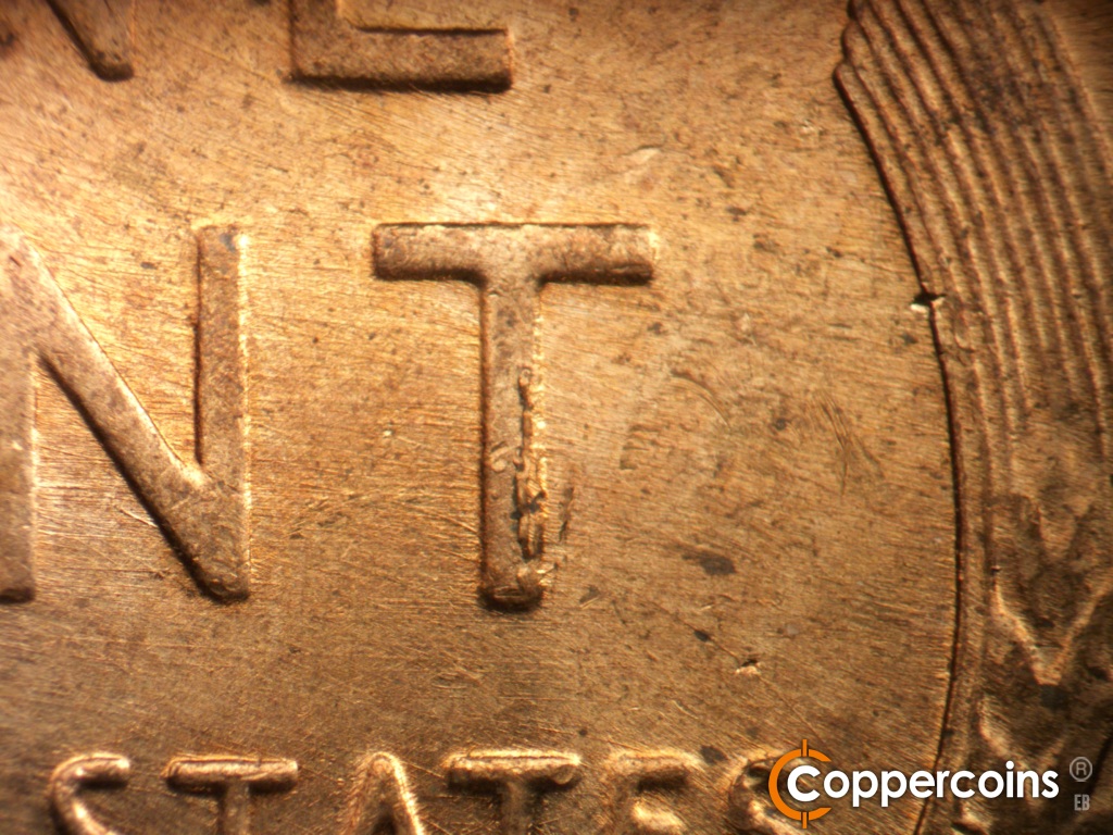 Die-stage B marker on 1957D•1MM•111 showing Die chipping on vertical of T in CENT.