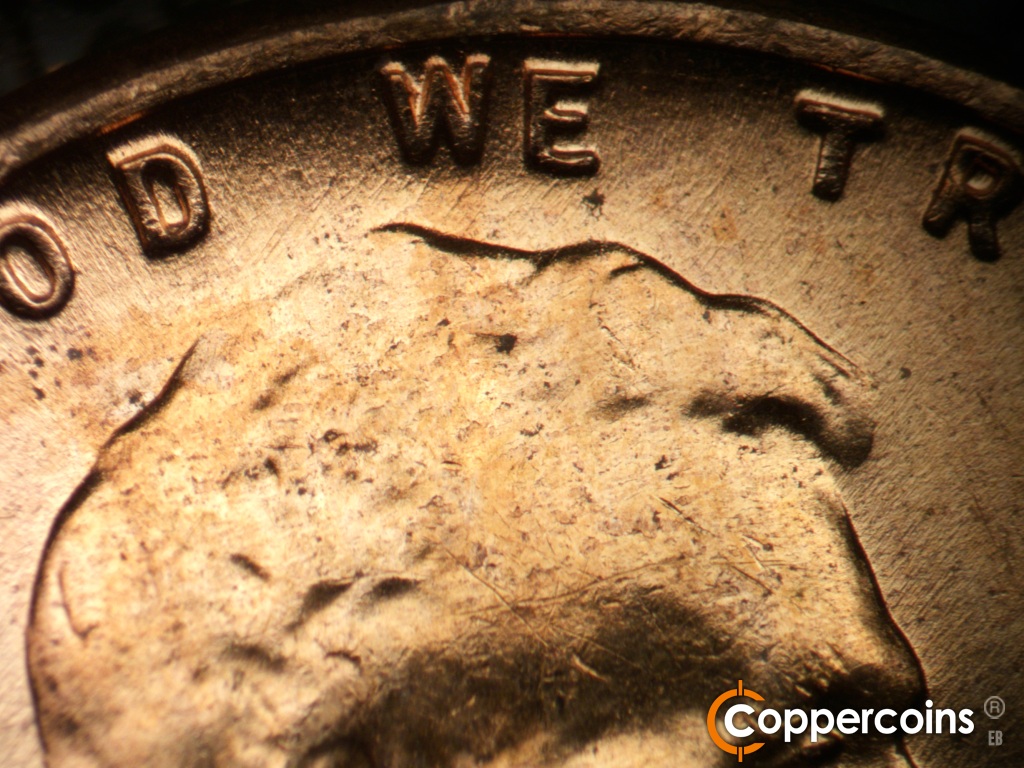 Die-stage B marker on 1957D•1MM•112 showing Light NE die scratches near WE.