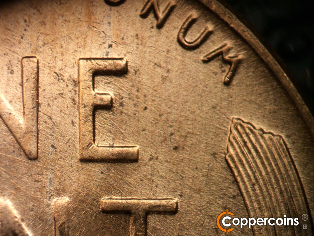Die-stage B marker on 1957D•1MM•112 showing Die scratches in E of ONE.
