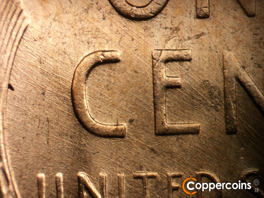 Die-stage B marker on 1957D•1MM•112 showing Die scratches through CENT.