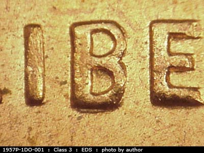 Die-stage A marker on 1957P•1DO•001 (1957 Doubled Die Obverse).