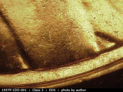 Die-stage A marker on 1957P•1DO•001 (1957 Doubled Die Obverse).