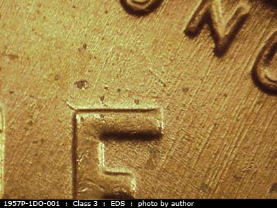 Die-stage A marker on 1957P•1DO•001 (1957 Doubled Die Obverse).