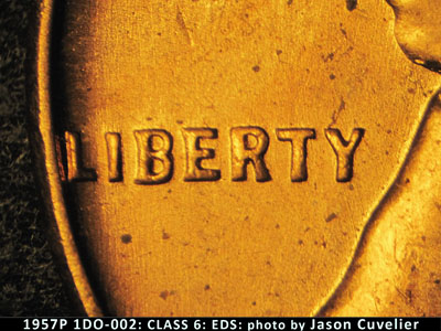 Die-stage A marker on 1957P•1DO•002 (1957 Doubled Die Obverse).
