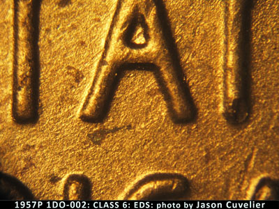 Die-stage A marker on 1957P•1DO•002 (1957 Doubled Die Obverse).