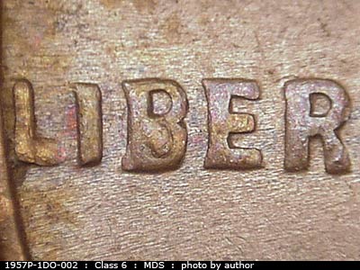 Die-stage B marker on 1957P•1DO•002 (1957 Doubled Die Obverse).