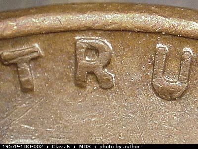 Die-stage B marker on 1957P•1DO•002 (1957 Doubled Die Obverse).