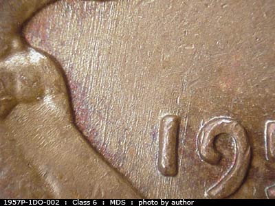 Die-stage B marker on 1957P•1DO•002 (1957 Doubled Die Obverse).