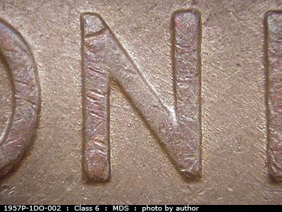 Die-stage B marker on 1957P•1DO•002 (1957 Doubled Die Obverse).