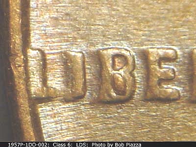 Die-stage C marker on 1957P•1DO•002 (1957 Doubled Die Obverse).