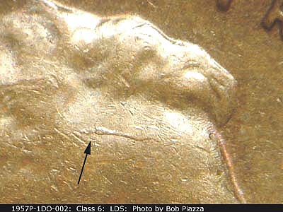 Die-stage C marker on 1957P•1DO•002 (1957 Doubled Die Obverse).