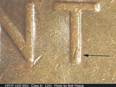 Die-stage C marker on 1957P•1DO•002 (1957 Doubled Die Obverse).