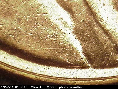 Die-stage B marker on 1957P•1DO•003 (1957 Doubled Die Obverse).