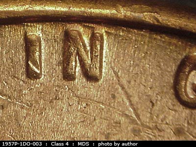 Die-stage B marker on 1957P•1DO•003 (1957 Doubled Die Obverse).