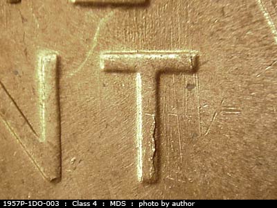 Die-stage B marker on 1957P•1DO•003 (1957 Doubled Die Obverse).