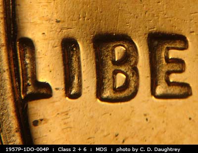 Die-stage B marker on 1957P•1DO•004P (1957 Doubled Die Obverse).