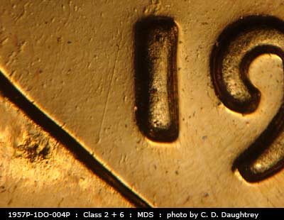 Die-stage B marker on 1957P•1DO•004P (1957 Doubled Die Obverse).
