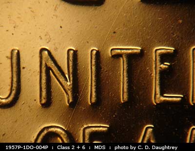 Die-stage B marker on 1957P•1DO•004P (1957 Doubled Die Obverse).