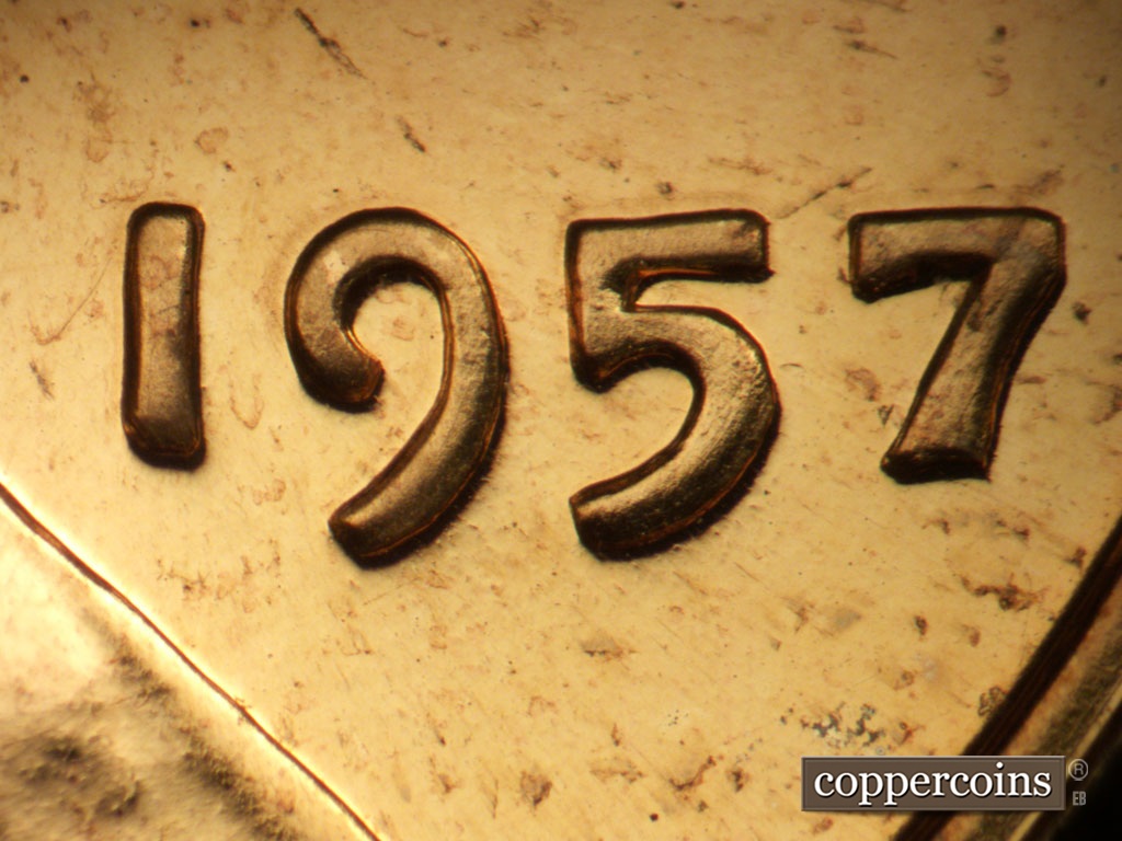 Die-stage B marker on 1957P•1DO•005P showing Extra thickness on date.