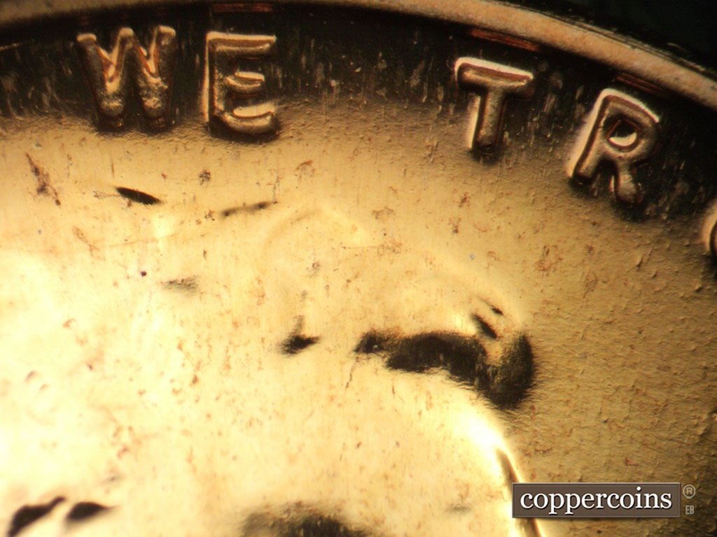 Die-stage B marker on 1957P•1DO•005P showing WE TRUST.