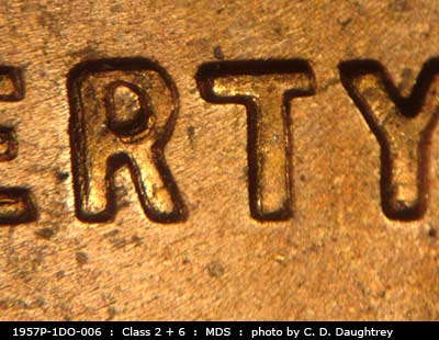 Die-stage B marker on 1957P•1DO•006 (1957 Doubled Die Obverse).
