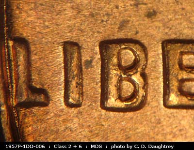 Die-stage B marker on 1957P•1DO•006 (1957 Doubled Die Obverse).