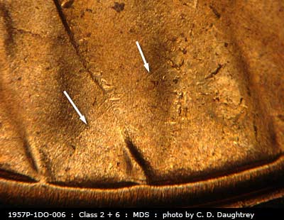Die-stage B marker on 1957P•1DO•006 (1957 Doubled Die Obverse).
