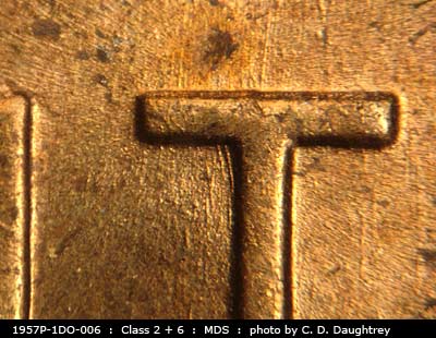 Die-stage B marker on 1957P•1DO•006 (1957 Doubled Die Obverse).