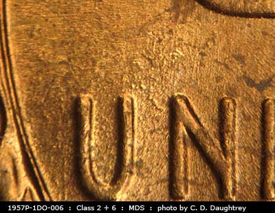Die-stage B marker on 1957P•1DO•006 (1957 Doubled Die Obverse).