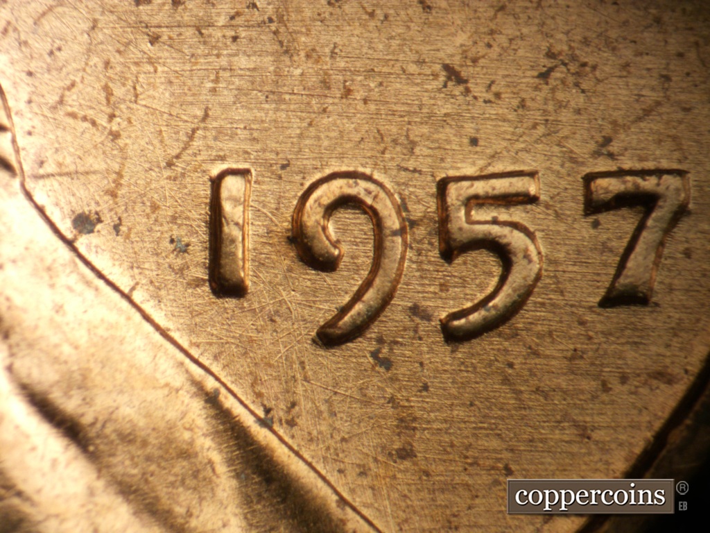 Die-stage B marker on 1957P•1DO•007 showing E/W die scratches through date.